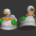 White Ducks Toy Decorations With Yellow Beaks And Green Wings On Dark Background