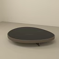 Modern Oval Coffee Table with Dark Smooth Surface in Minimalist Room Setting 3d model