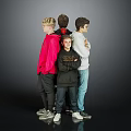 Four Boys Standing Back to Back With Colorful Jackets Against Gray Background