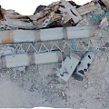 Rusted Metal Scrap Scattered With Pipes Frames And Broken Parts On Sandy Ground