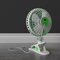 Three Green And White Tabletop Air Conditioner Fans With Stands On Wooden Floor