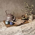 Elegant Tea Set with Brown Teapot Blue Cups and Checkered Cloth on Wooden Tray