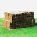 Stacked Hay Bales Arranged On Lush Green Grass In Open Field