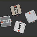 Four White Storage Containers With Red Black Accents And Sleek Design