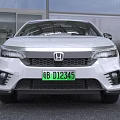 White Honda Sedan With Modern Exterior Design And Green License Plate