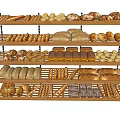 Assorted Freshly Baked Bread Loaves Rolls And Sticks On Wooden Bakery Shelves