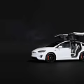 White Tesla Model X With Open Falcon Wing Doors On Dark Background