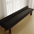 Black Sofa Bench With Wooden Legs On Herringbone Wooden Floor And White Curtains By Window