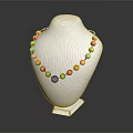 Yellow Beaded Necklace With Red Accent Beads And Pendant On Mannequin