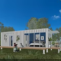White Container House with Wooden Deck Green Plants Natural Surroundings by Water Under Blue Sky