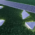Illuminated Triangular Garden Ornaments In Green Grass With Gravel Path Landscape