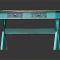 Teal Colored Wooden Top Table With Carved Drawers And Cross Legs Design