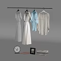 Collection of White and Light Clothes Hanging on Hangers with Decorative Mirror Frame and Towel
