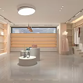 Modern Clothing Store Interior With Bright Lighting Central Display Table And Wooden Display Shelves
