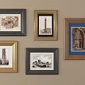 Various Framed Decorative Artworks With Architectural Prints On Beige Wall