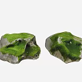 Rough Natural Stones Covered With Lush Green Moss And Textured Surfaces