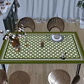 Elegant Dining Table Set With Green White Checkered Tablecloth Rattan Chairs And Decorative Tableware