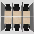 Multiple Office Desks In Cubicles With Light Wood Surface And Black Chairs