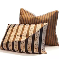 Decorative Striped Bed Pillows With Brown Black Patterns And Soft Textured Fabric
