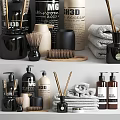 Stylish Bathroom Accessories with Towels Brush Glass Bottles and Diffuser Sticks