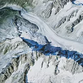 Alpine Mountain Terrain Featuring Snow Capped Peaks Glaciers And Rocky Ridges