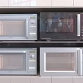 Four Different Style Gray And Black Microwaves Stacked In Two Layers As Kitchen Appliances