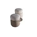 Modern Stools With Round Padded Seats And Cylindrical Bases In Neutral Tones