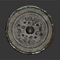 Ancient Bronze Circular Sculpture With Intricate Carved Patterns And Central Motif