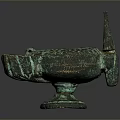 Antique Bronze Sculpture Featuring Three Legs Long Spout And Textured Green Patina