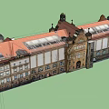 Historic Building Exterior With Red Roof Arched Doors Windows And Tower