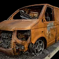 Rusted Damaged Van With Burnt Body And Broken Metal Parts