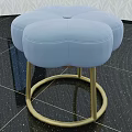 Elegant petal shaped light blue sofa stool with golden metal base for modern living room