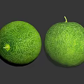 Two Fresh Green Melons With Netlike Texture And Small Stems On Black Reflective Surface
