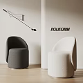Dark Gray and Beige Upholstered Stools in POLIFORM Space with Light Wall and Black Wall Lamp