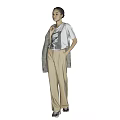 Woman Standing in White Graphic T-Shirt Beige Trousers Gray Coat Over Shoulder Against Gray Background