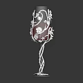 Decorative Wine Glass With Intricate Patterns And Red Liquid In Transparent Base