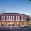 Commercial Street Red Brick Buildings Arched Windows Illuminated Evening Atmosphere Pedestrians Parked Cars and Trees