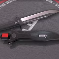 Two Tactical Knives Displayed On Textured Mat