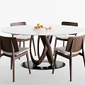 Modern Round Dining Table And Chairs Set With White Tabletop Crossed Legs And Orange Fruits