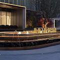 Modern Garden Decor With Outdoor Fountain Green Shrubs And Golden Letter M