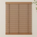 Wooden Blinds Mounted On Light Colored Wall With Green Plant Branch