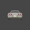 Sleek White Classic Sports Car With Streamlined Body And Chrome Wheels