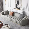 Gray Large Sofa With Gold Trim And Decorative Pillows In Elegant Living Room