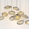Irregular Shaped Glass Pendant Lights Hanging With Warm Yellow Glow For Modern Interior