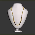 Yellow Beaded Necklace With Black Accents On White Mannequin