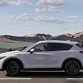 White Mazda SUV Modern Exterior Design With Trees And Road Background