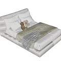 Single Bed With White Headboard Green Quilt Gray Blanket Pillows And Stuffed Toy
