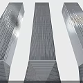 Three Tall Office Buildings With Blue Glass Curtain Walls And Green Plants At The Base