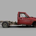 Rusty Red Old Truck Cab Body With Dismantled Chassis And Wheels