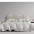 Kids Bed With Curved Beige Headboard White Bedding And Wooden Nightstands